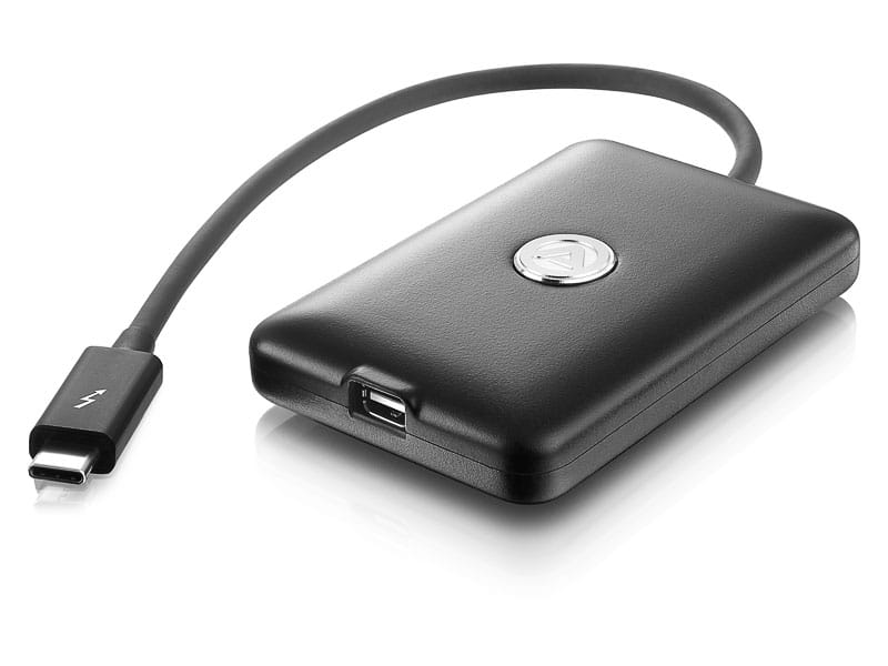 a black portable external hard drive with a short usb cable attached the device features a shiny logo in the center and has one usb port visible on the side digital production A black portable external hard drive with a short USB cable attached. The device features a shiny logo in the center and has one USB port visible on the side.
