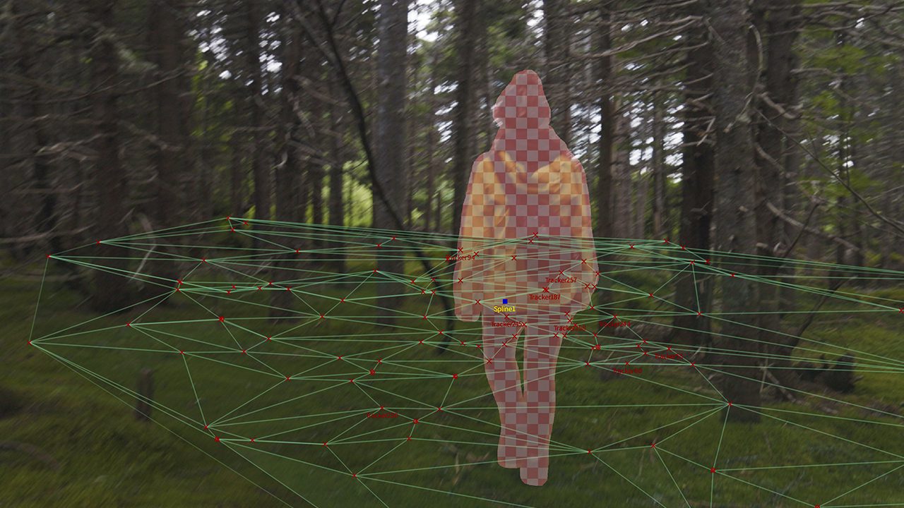 a person wearing a checked yellow and red jacket stands in a forest surrounded by tall trees a digital grid overlays the scene creating a sense of depth and structure in the forest environment digital production A person wearing a checked yellow and red jacket stands in a forest, surrounded by tall trees. A digital grid overlays the scene, creating a sense of depth and structure in the forest environment.