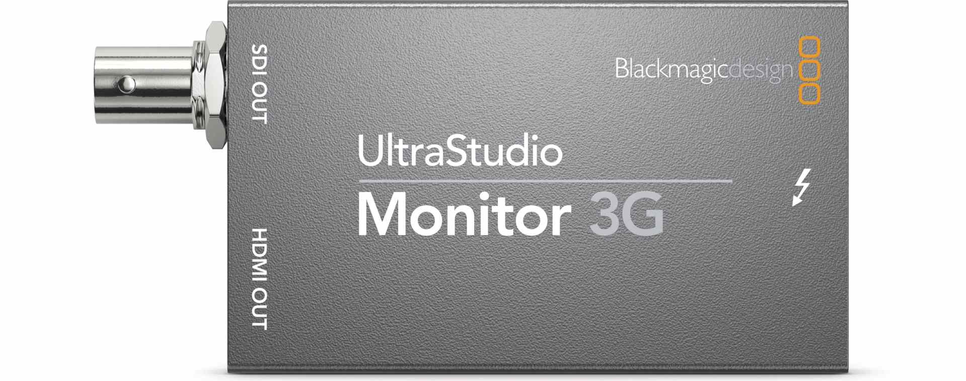 a gray external video monitor device labeled ultrastudio monitor 3g featuring ports for hdmi output and sdi output with a thunderbolt connection the device is from blackmagic design digital production A gray external video monitor device labeled UltraStudio Monitor 3G, featuring ports for HDMI output and SDI output, with a Thunderbolt connection. The device is from Blackmagic Design.