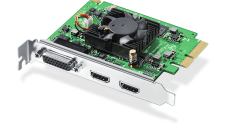 a computer graphics card showcasing a green circuit board with a cooling fan two hdmi ports and a dvi port on the back panel the card is partially standing upright to display its components clearly digital production A computer graphics card showcasing a green circuit board with a cooling fan, two HDMI ports, and a DVI port on the back panel. The card is partially standing upright to display its components clearly.